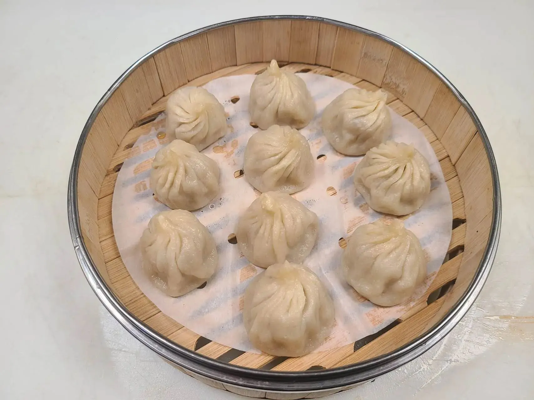 Juicy pork soup dumplings steamed in bamboo steamer at 1st Dumpling N Noodle, a Chinese Restaurant in CA