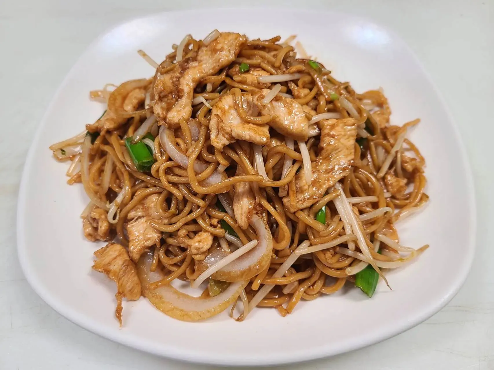 Stir‑fried noodles with chicken, bean sprouts and green onions at 1st Dumpling N Noodle, a Chinese Restaurant in CA Stir‑fried noodles with chicken, bean sprouts and green onions at 1st Dumpling N Noodle, a Chinese Restaurant in CA